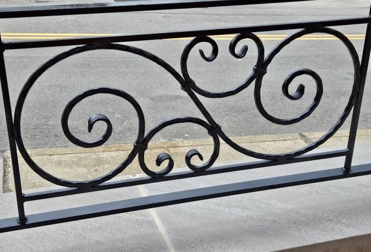 Custom metal fabrication by Monaco Metalworks — ornamental scrollwork railing